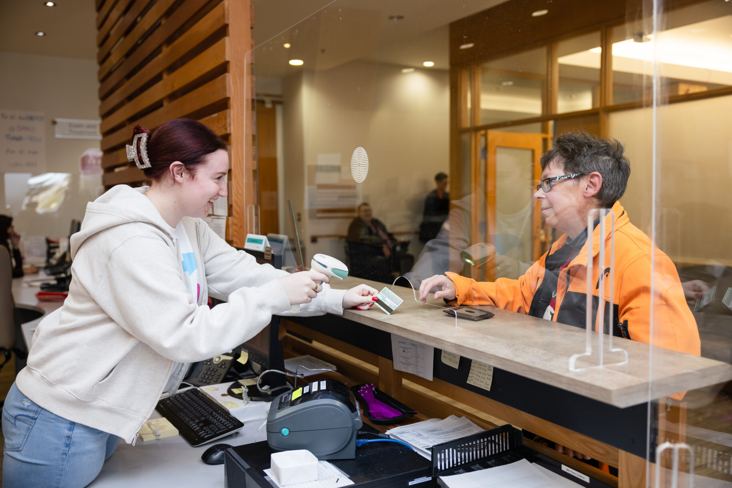 Patient checking in at the radiation check-in desk at WRHN Cancer Centre.